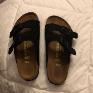 Black suede Birkenstock’s